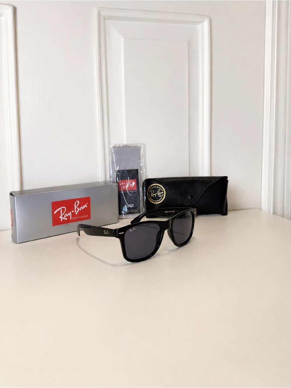 Ray-Ban Black Frame Sunglasses with Dark Gray Lenses